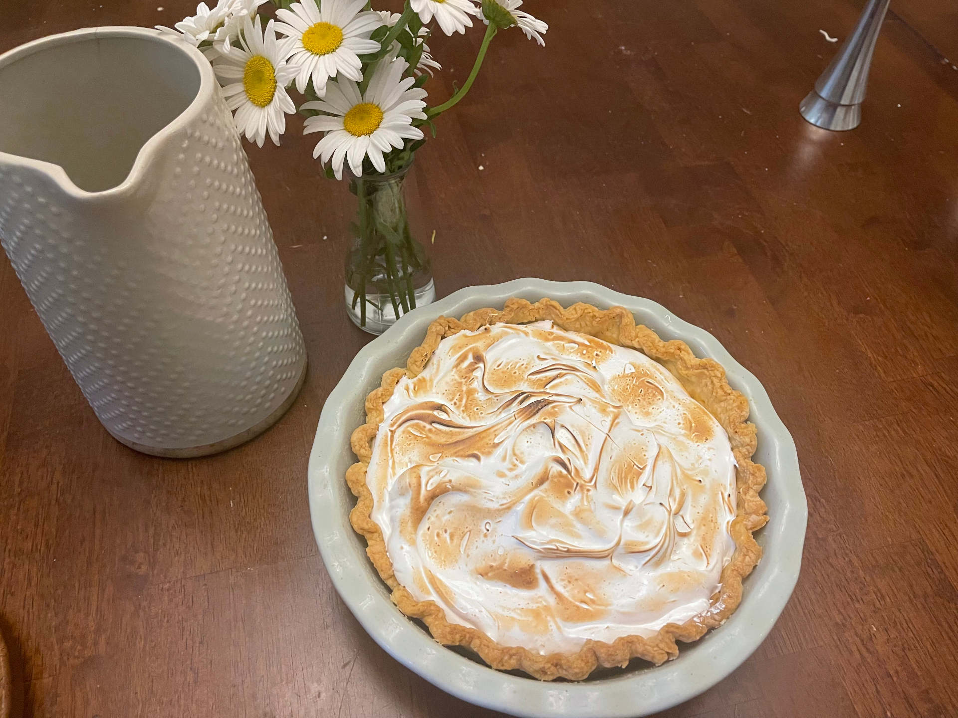 Toasted meringue pie in a scalloped dish